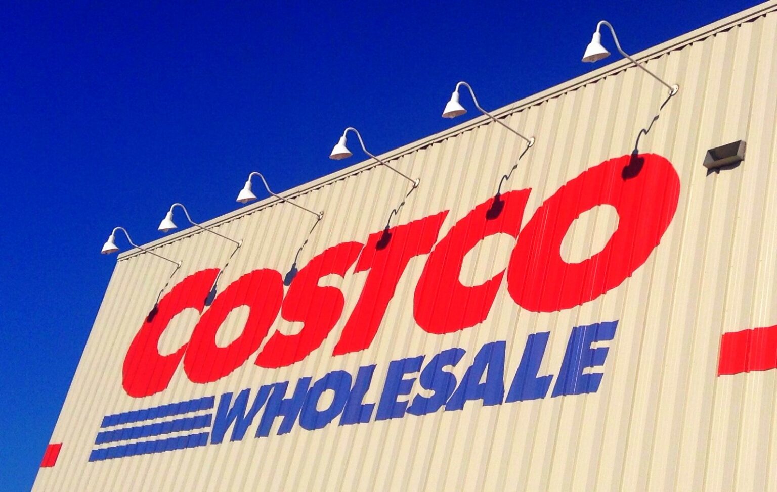 photo of costco building against blue sky.