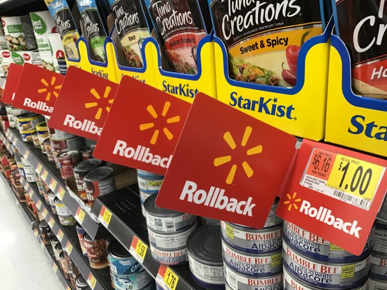 Walmart aisle with rollback pricing tags prominently displayed