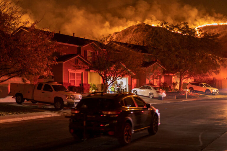 CHINO HILLS, CA - OCTOBER 27: Flames come close to houses during the Blue Ridge Fire on October 27, 2020 in Chino Hills, California. Strong Santa Ana Winds gusting to more than 90 miles per hour have driven the Blue Ridge Fire and Silverado Fire across thousands of acres, grounding firefighting aircraft, forcing tens of thousands of people to flee and gravely injuring two firefighters. More than 8,200 wildfires have burned across a record 4 million-plus acres so far this year, more than double the previous record.