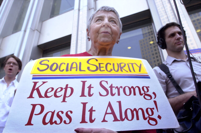 390742 05: A protester demonstrates against a Bush administration plan to add private investment accounts to Social Security, June 18, 2001 in New York City moments after U.S. Treasury Secretary Paul O''Neill addressed a luncheon given by the Coalition for American Financial Security.