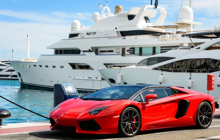 lamborghini parked in front of yachts