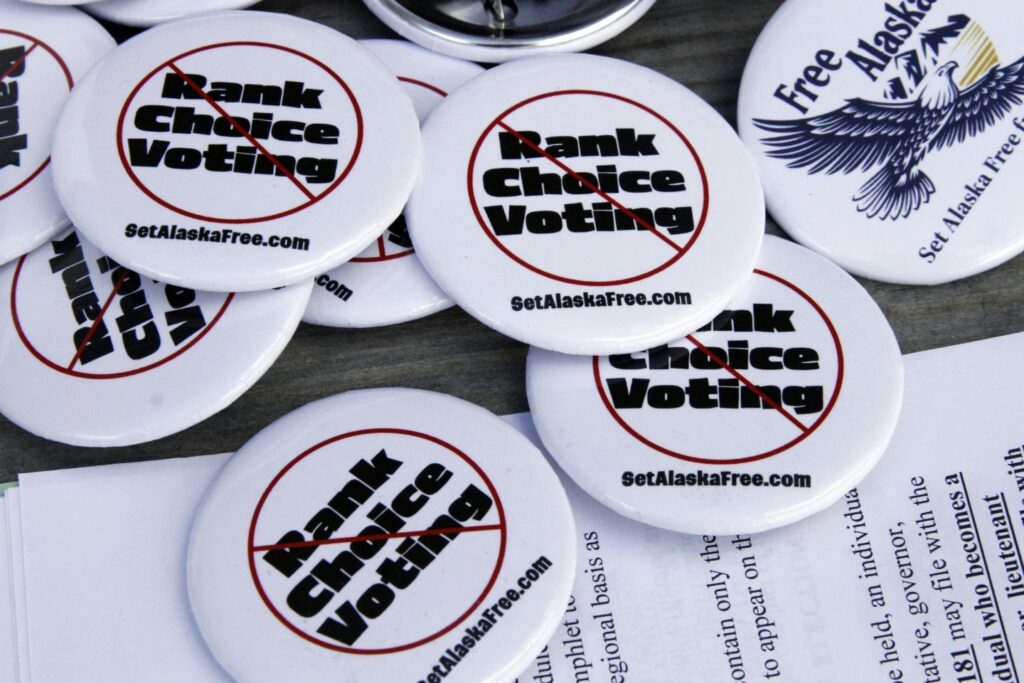 anti ranked-choice voting buttons as the Alaska supreme court rules in its favor