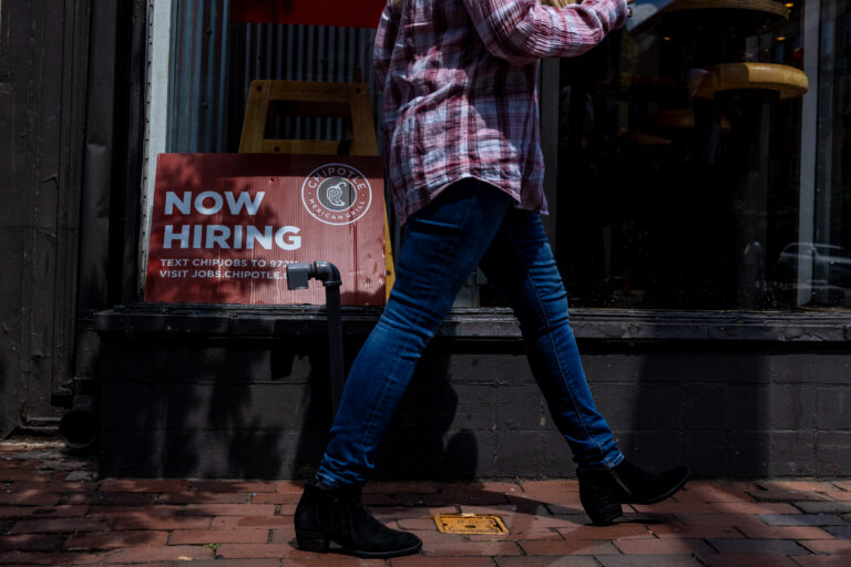 ALEXANDRIA, VA - AUGUST 22: A hiring sign is displayed in the window of a Chipotle on August 22, 2024 in Alexandria, Virginia. According to reports, over 800,000 fewer jobs were created within the U.S. economy than originally reported in the 12-month period, 30% less than the previously reported 2.9 million from April 2023 through March, 2024. job openings are on the decline