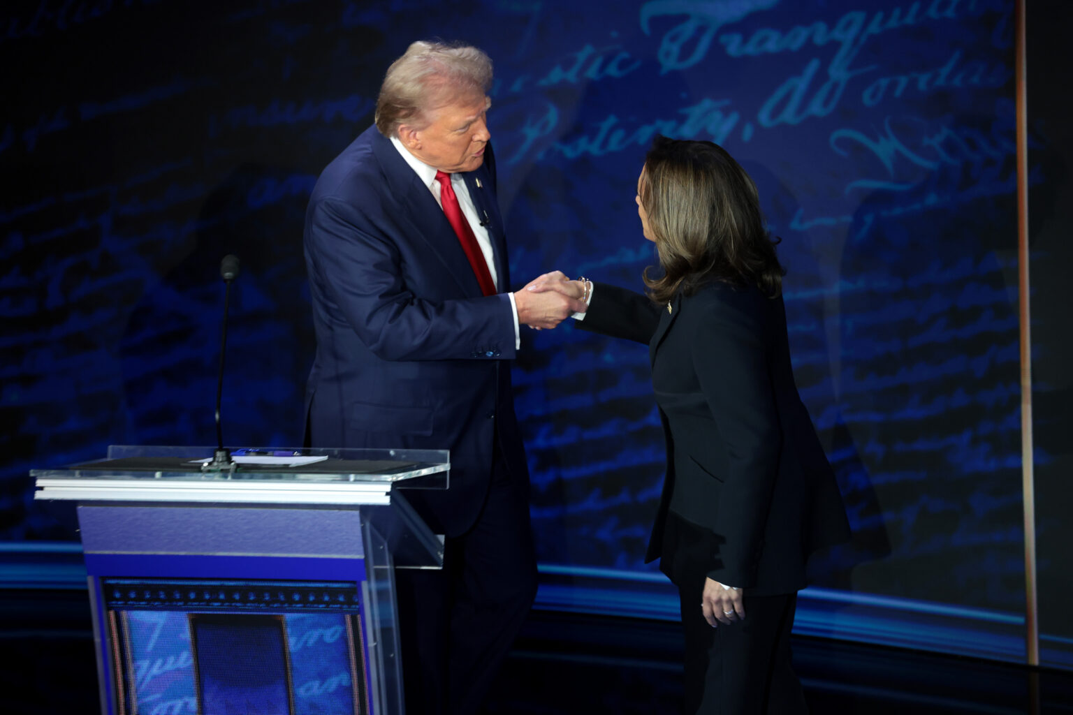 PHILADELPHIA, PENNSYLVANIA - SEPTEMBER 10: Republican presidential nominee, former U.S. President Donald Trump and Democratic presidential nominee, U.S. Vice President Kamala Harris greet as they debate for the first time during the presidential election campaign at The National Constitution Center on September 10, 2024 in Philadelphia, Pennsylvania. After earning the Democratic Party nomination following President Joe Biden's decision to leave the race, Harris faced off with Trump in what may be the only debate of the 2024 race for the White House. In the debate, Harris calls Trumps tariff proposals the "Trump sales tax"