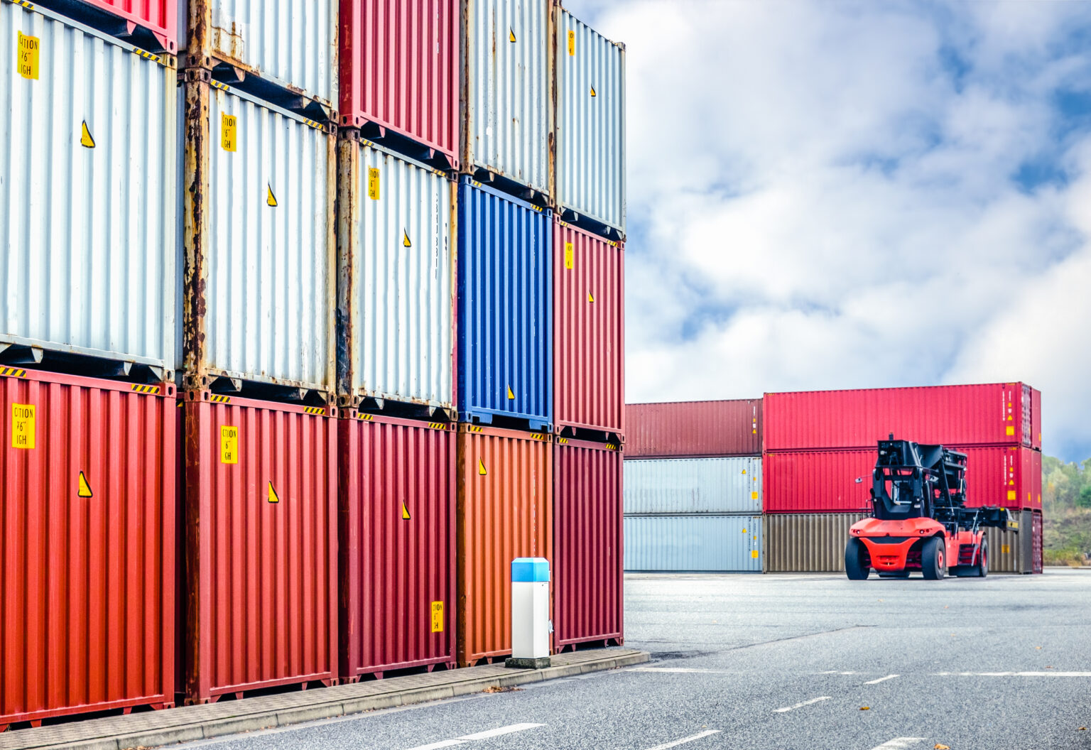 Stacked up cargo containers with crane. Harbour Hannover, Germany, 15 November 2014 to symbolize global trade deficit