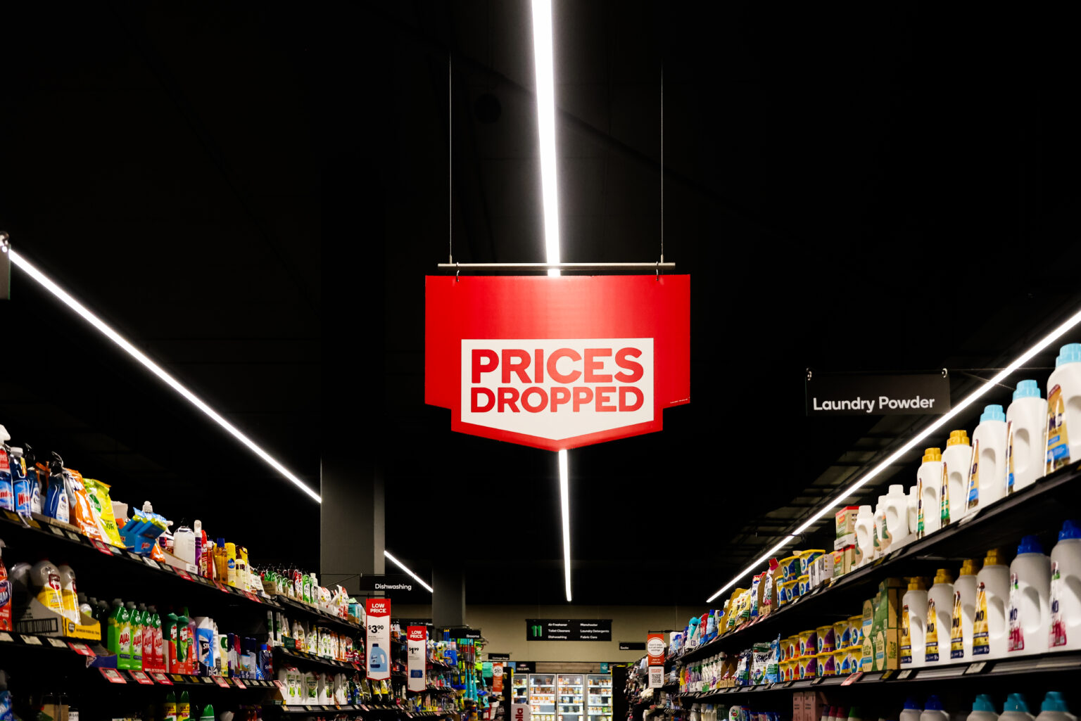 MELBOURNE, AUSTRALIA - MARCH 19: A prices dropped sign at a Woolworths supermarket on March 19, 2024 in Melbourne, Australia. Australia's two major supermarket chains, Coles and Woolworths, have come under scrutiny for their role in the cost of living crisis in the country, with both companies significantly increasing their profits during the pandemic while consumers faced rising living costs, local media reports said. Former cabinet minister Craig Emerson is leading a government inquiry into supermarket deceptive pricing practices, while former ACCC chair Allan Fels is conducting a separate investigation in collaboration with the Australian Council of Trade, ABC News said.