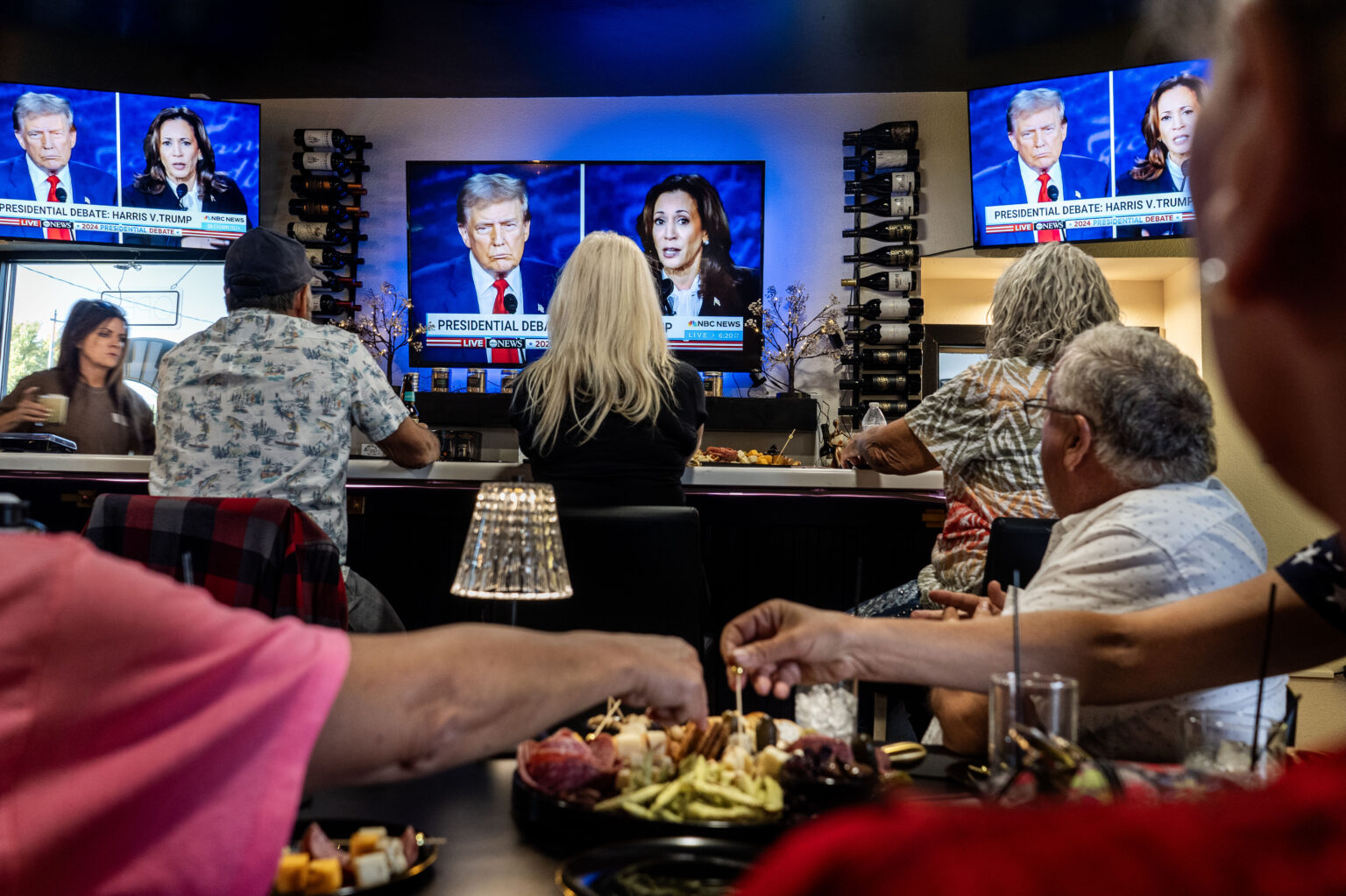 WINNEMUCCA, NEVADA: Winnemucca Republicans gather at a wine bar to watch the Presidential debate between Vice President Kamala Harris and former President Donald Trump in Winnemucca, Nevada on Tuesday, September 10, 2024.