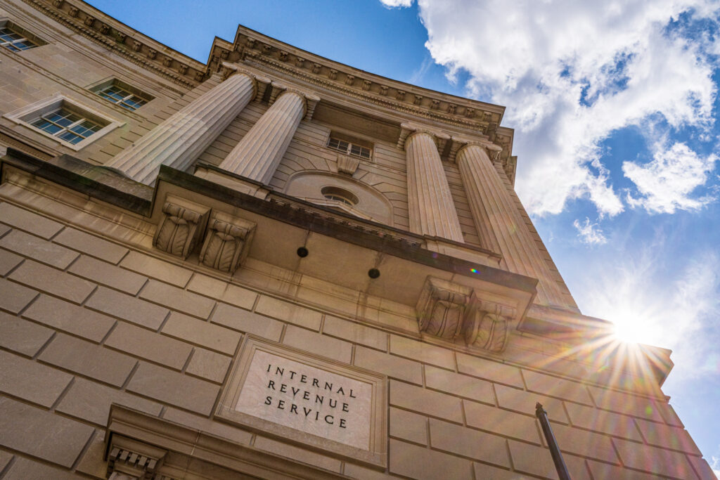 WASHINGTON, DC - SEPTEMBER 15: The sun flairs over the side of the U.S. Internal Revenue Service (IRS) headquarters building on September 15, 2024, in Washington, DC. the IRS crackdown has recovered more than 1.3 billion