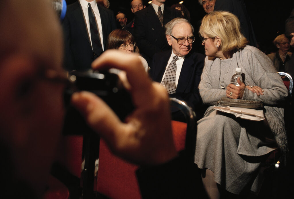 Warren Buffett, CEO of Berkshire Hathaway, attends the company's annual shareholders' meeting with his daughter (left) and his wife, both named Susan. Buffett and his wife have been apart since 1977, but they remain friends and business partners. Berkshire investors gather to hear Buffet and other managers speak in Ak-Sar-Ben Coliseum in Omaha, Nebraska. (Photo by mark peterson/Corbis via Getty Images). buffett says that your partner is the most important financial decision you'll ever make