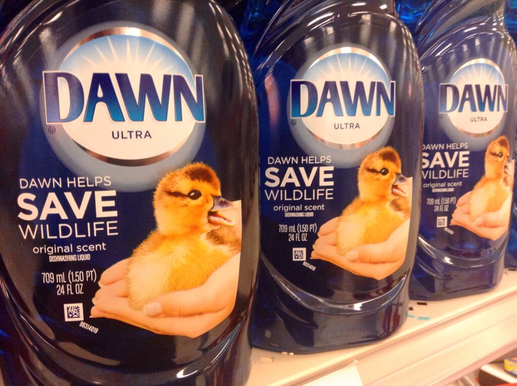 three bottles of dawn dishsoap on a grocery store shelf 