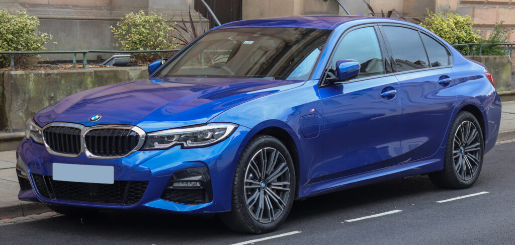 a blue 2019 bme 330e MSport Automatic 2.0 street parked