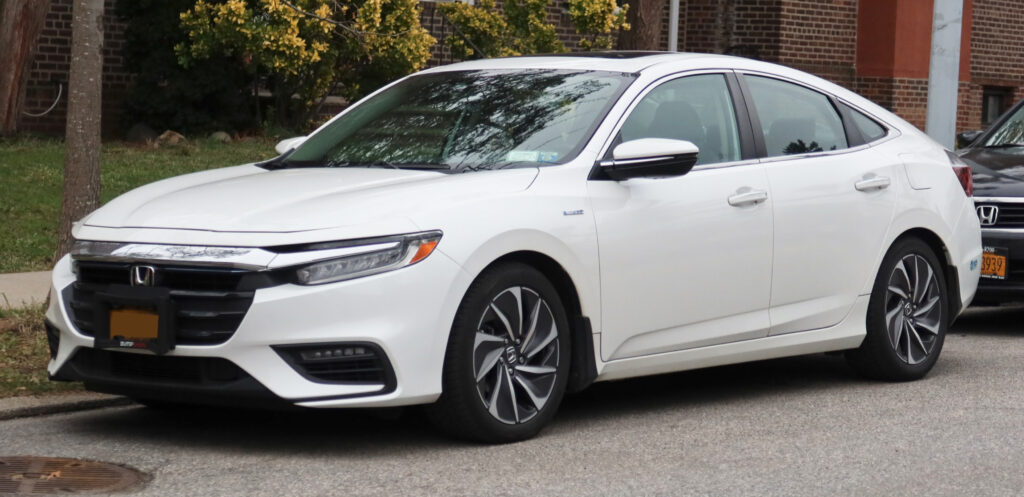 A white 2020 Honda Insight Touring street parked in Kew Gardens Hills, Queens, New York, USA. 