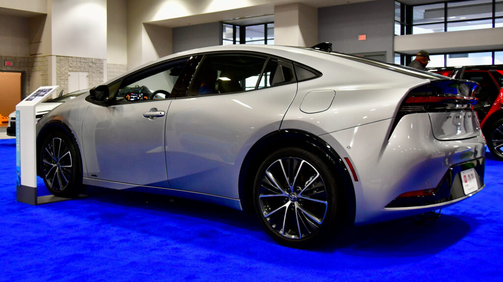 white 2024 Toyota Prius in Silver in a show room