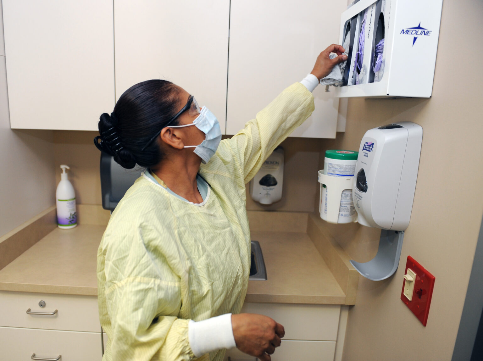 LOMA LINDA, CALIFORNIA - JULY 16: Hospital worker Margarita Navarrete sterilizes a critical-care hospital room at Loma Linda Medical Center, University Heart & Surgical Hospital, July 16, 2012 in Loma Linda, California.