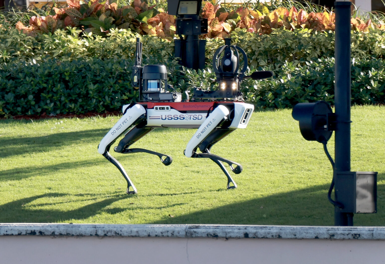 PALM BEACH, FLORIDA - NOVEMBER 15: A U.S. Secret Service robot dog manufactured by Boston Dynamics patrols the grounds at President-elect Donald Trump's Mar-a-Lago resort on November 15, 2024 in Palm Beach, Florida. The Trump administration has been announcing a number of nominees to fill out his upcoming administration.