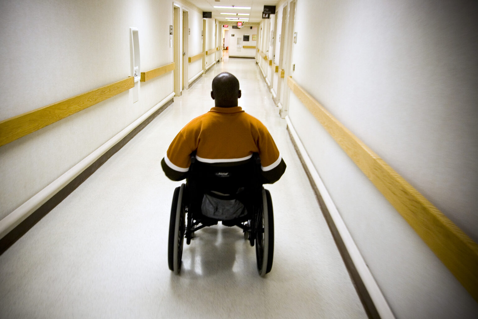 WASHINGTON, D.C. - MARCH 17: Eugene Simpson, 29, from Dale City, Virginia goes through physical therapy at the Veterans Affairs Medical Center in Washington, D.C. with Michael Minor, a kinesiotherapist with the United States Department of Veterans Affairs on March 17, 2006 in Washington, D.C., USA. Simpson, was left paralyzed after an Improvised Explosive Device (I.E.D.) wounded him while on patrol outside of Tikrit, Iraq on while serving as a United States soldier on April 7, 2004. Prior to his injury, Simpson had been a standout athlete, playing both football and basketball in college.