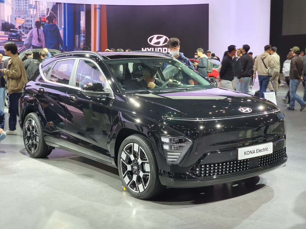 A black Hyundai Kona Electric in a showroom