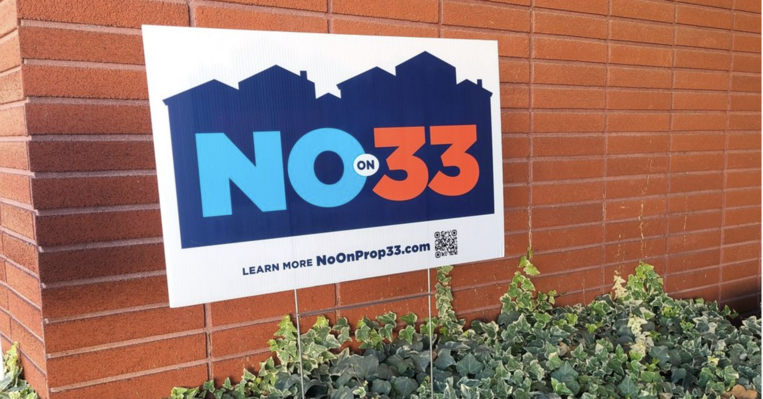 A no on Prop 33 sign in a front yard in California