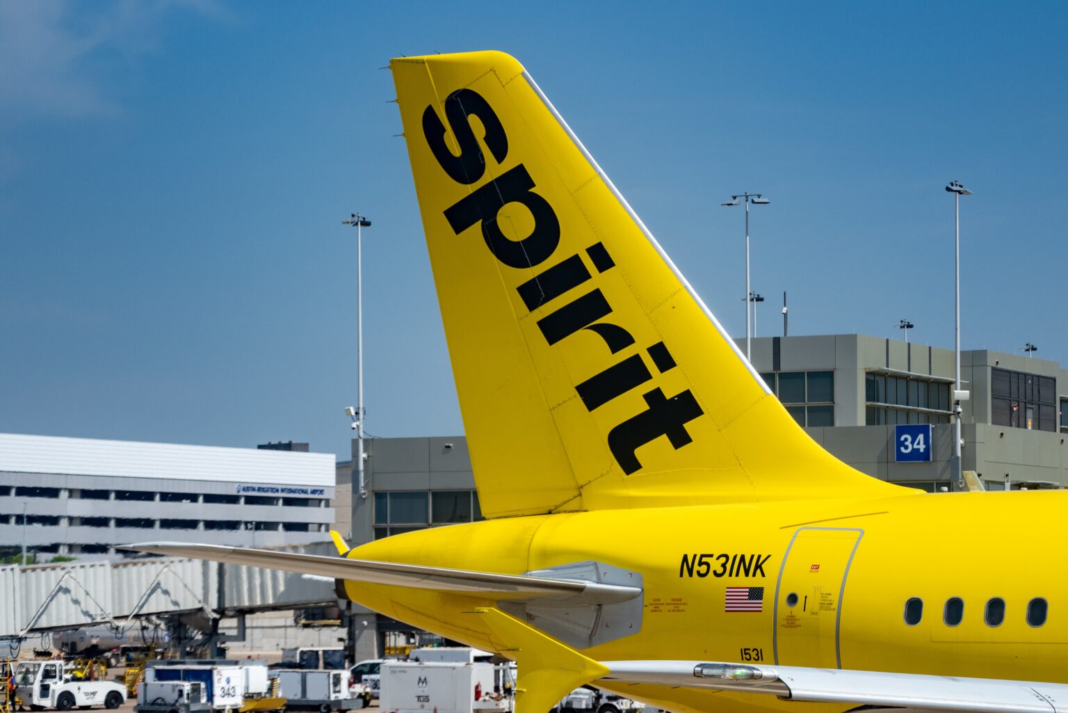 Logo for Spirit Airlines on a yellow jet airplane at Austin-Bergstrom International Airport, Austin, Texas, March 11, 2023.